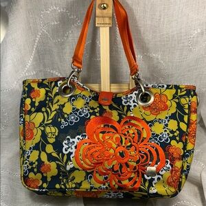 Haiku shoulder bag with padded sleeve for electronics, pockets for organization